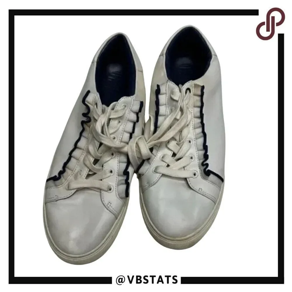 Tory Burch Ruffle sneakers. Size 10M. White with elegant‎ black ruffle.